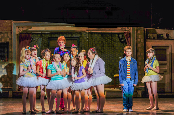 Janet Dickinson (Mrs. Wilkinson), Drew Minard (Billy), Samantha Blaire Cutler (Debbie) and the cast of “Billy Elliot the Musical.”  Photo by Amy Boyle