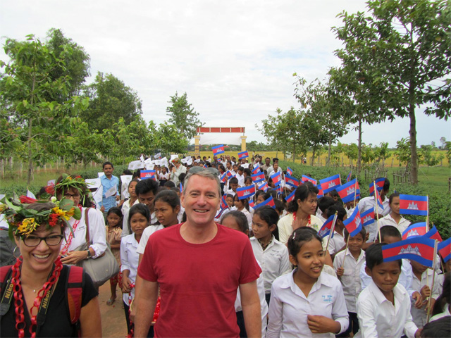 John joined by Cambodian children